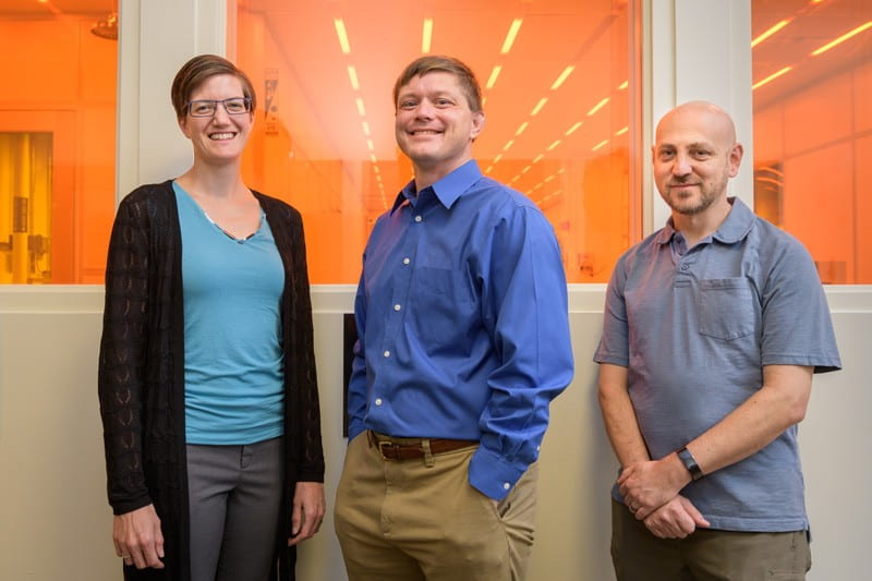 As part of a National Science Foundation initiative to advance the quantum technology revolution, University of Delaware researchers will explore a new approach to making quantum devices, 10,000 times smaller than the width of a human hair, in UD’s Nanofabrication Facility, shown behind them. Project leader Matthew Doty (center) is flanked by team members Stephanie Law and Joshua Zide. All are professors in UD’s Department of Materials Science and Engineering.